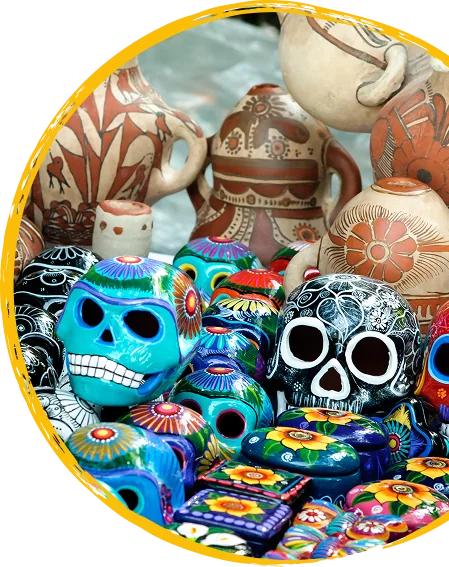 Brightly painted ceramic sugar skulls on a market table
